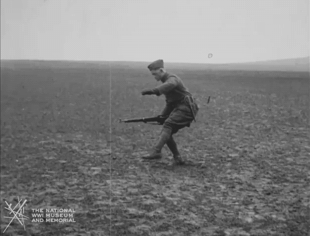 A black and white clip of a soldier walking through a minefield carefully.