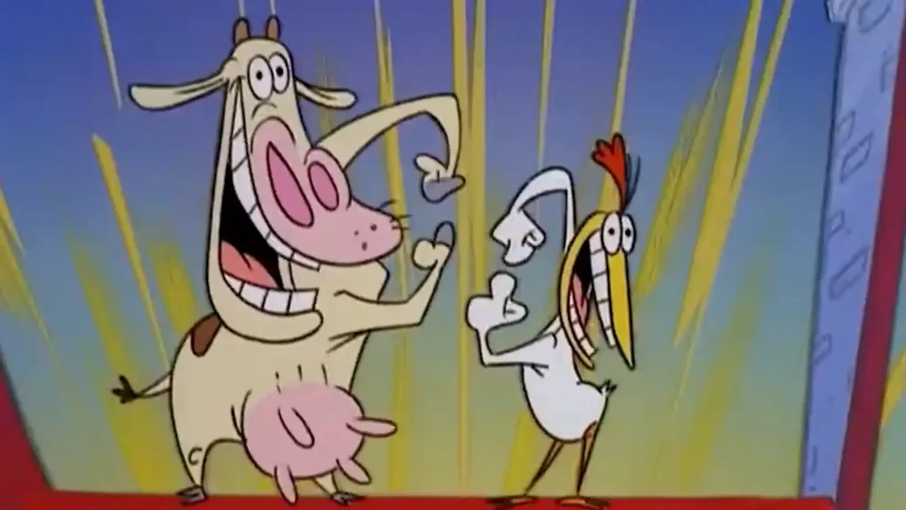 Vaca y pollo bailando.